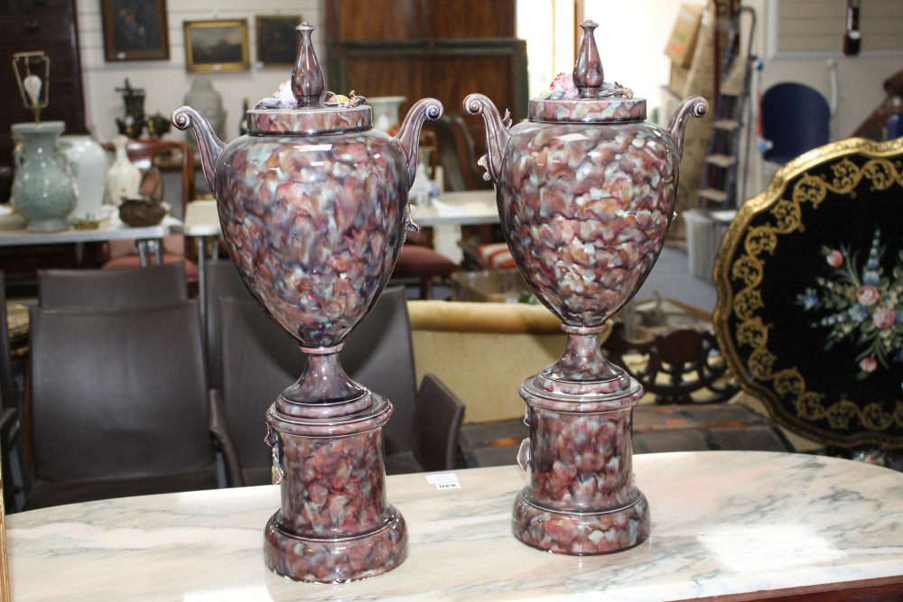 A pair of Italian floral encrusted pottery vases and covers, height 58cm
